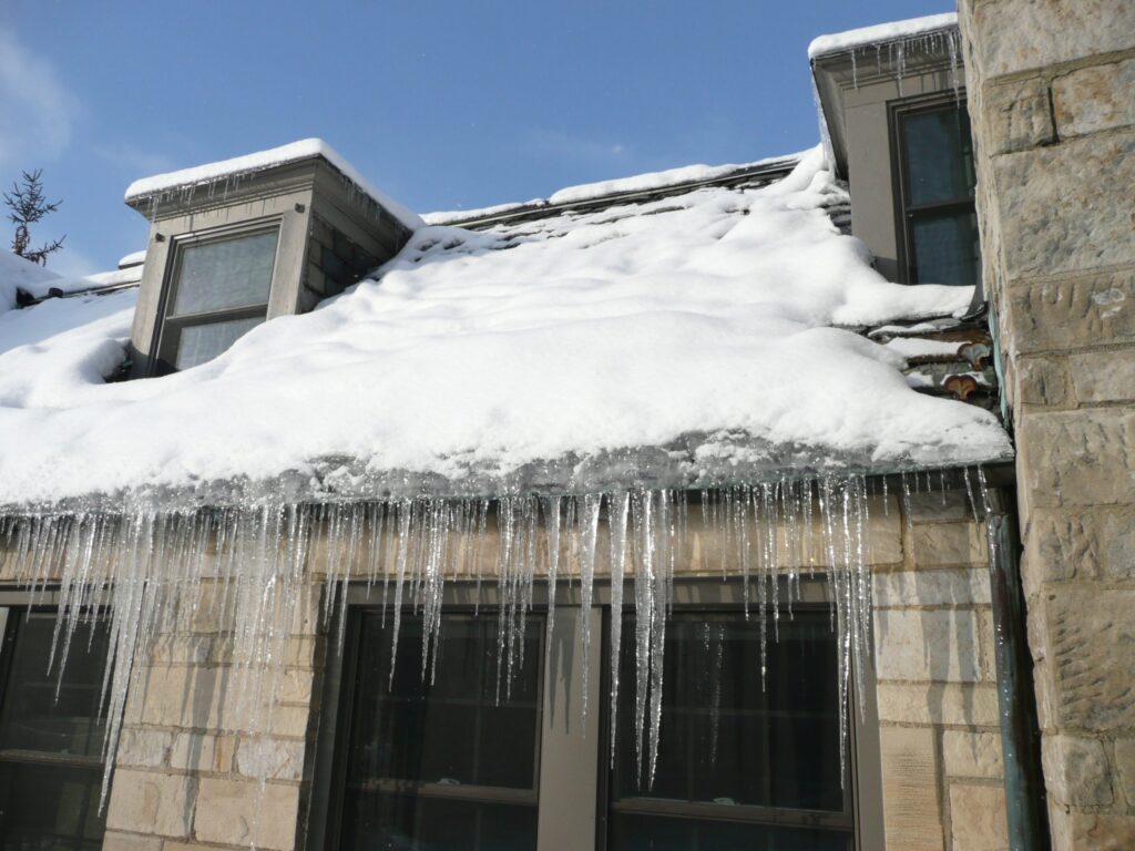 Snow and ice building up on a roof