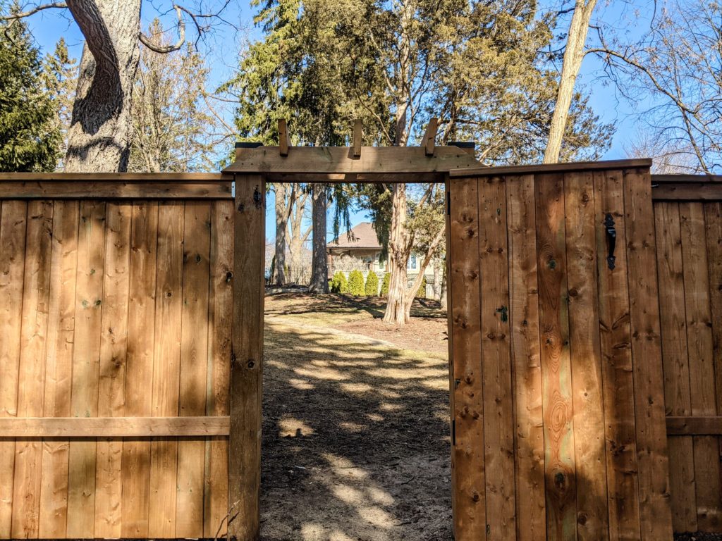 Fence gate leading to backyard.